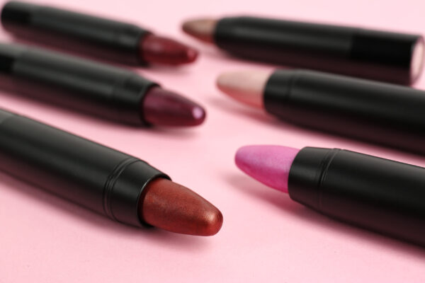 set of bright lipsticks in black tubes on pink bac 2026 03 20 20 16 05 utc