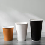 stack of coffee cups in various colors with lids o 2026 03 24 12 37 53 utc
