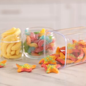 tasty gummy candies in glass jars on white marble 2026 01 11 11 08 32 utc