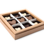tasty heart shaped chocolate candies in box isolat 2026 01 13 20 41 14 utc