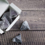tea bag shape of pyramid in paper packaging box on 2026 03 24 09 01 12 utc