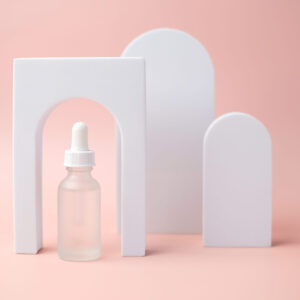 the white skincare dropper bottle is on pink backg 2026 01 07 00 24 00 utc