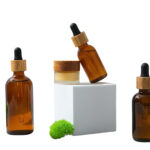 three bottles and cream jar shown isolated on whi 2026 01 09 10 54 49 utc