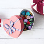 top view of open heart shape gift box on white bac 2026 01 07 01 24 11 utc