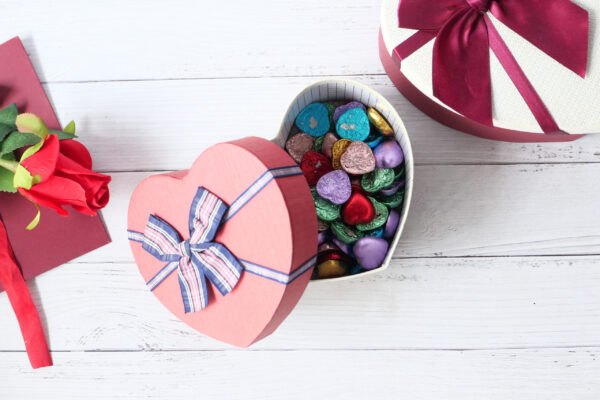 top view of open heart shape gift box on white bac 2026 01 07 01 24 11 utc