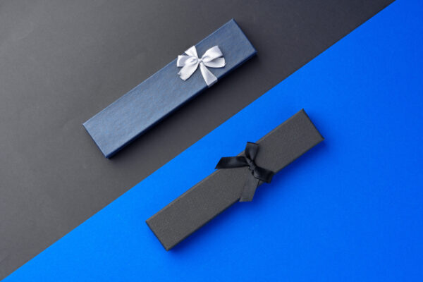 two long jewelry boxes on black and blue backgroun 2026 03 19 02 22 12 utc