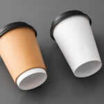 two paper takeout coffee cups on gray background 2026 03 19 03 13 03 utc