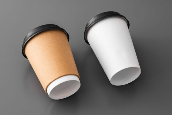 two paper takeout coffee cups on gray background 2026 03 19 03 13 03 utc
