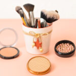 a set of cosmetics on a pink background with a chr 2026 03 20 00 37 44 utc