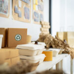 a stack of cardboard boxes with green recycling sy 2026 03 24 07 41 31 utc