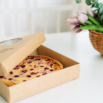 an open box with berry pie stands on white table 2026 03 19 02 53 14 utc