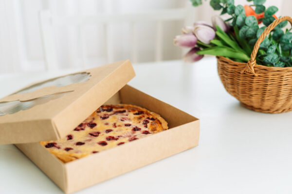 an open box with berry pie stands on white table 2026 03 19 02 53 14 utc