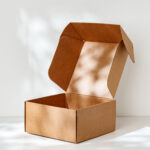 an open cardboard box rests on a bright white surf 2026 03 24 01 27 11 utc