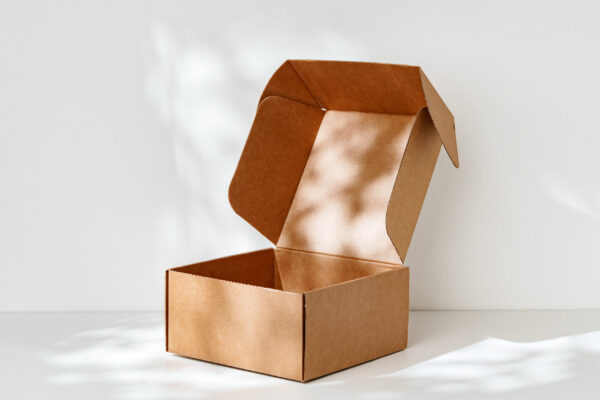 an open cardboard box rests on a bright white surf 2026 03 24 01 27 11 utc