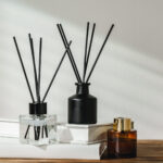aromatic reed diffuser on white books with shadows 2026 03 24 12 58 01 utc