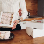 attractive woman holds a box with marshmallows in 2026 03 19 08 20 02 utc