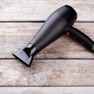 black hair dryer on wooden background 2026 03 09 05 39 47 utc