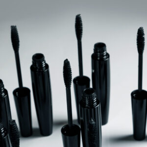 black mascara brushes and containers on gray backg 2026 01 05 05 08 04 utc