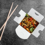 black wok container with rice noodles fast food d 2026 04 05 00 12 56 utc