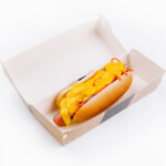 cheesy hot dog in takeaway box on white background 2026 01 08 05 46 12 utc