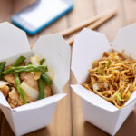 chinese take out food in boxes close up with mobil 2026 01 06 09 57 05 utc