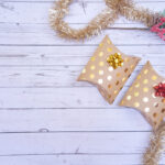 christmas gifts placed on a wooden table backgroun 2026 03 20 00 18 04 utc