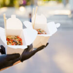 close up man eating spicy udon with chopsticks in 2026 04 05 00 17 08 utc