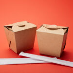close up view of chopsticks and noodle boxes on re 2026 03 12 22 47 23 utc (1)