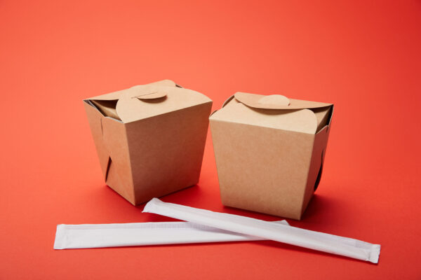 close up view of chopsticks and noodle boxes on re 2026 03 12 22 47 23 utc (1)