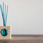 closeup of a blue air freshener with reed sticks o 2026 03 18 16 20 33 utc