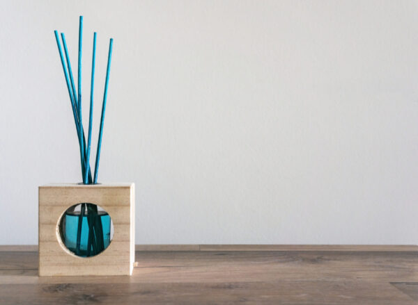 closeup of a blue air freshener with reed sticks o 2026 03 18 16 20 33 utc