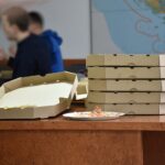 closeup of pizza cardboard boxes on table 2026 03 20 05 52 56 utc
