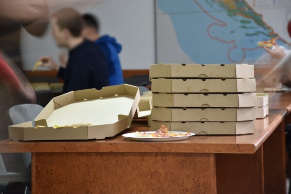 closeup of pizza cardboard boxes on table 2026 03 20 05 52 56 utc