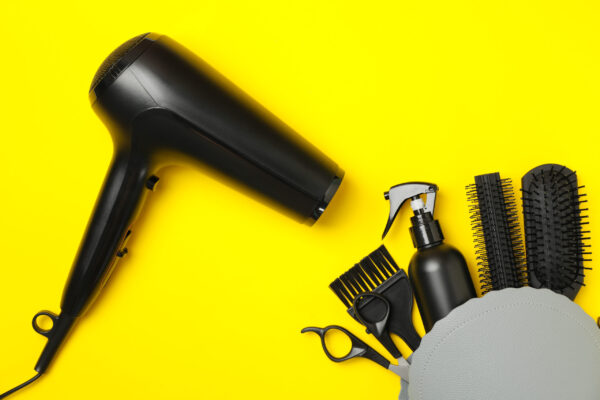 composition with hairdresser accessories on yellow 2026 03 24 21 57 35 utc