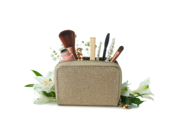 cosmetic bag with cosmetics and flowers isolated o 2026 03 24 23 47 44 utc