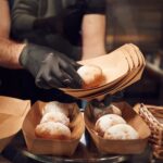 delicious donuts man is taking food in the worksp 2026 03 24 07 07 21 utc