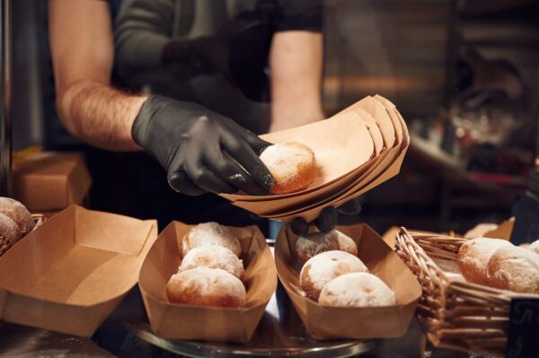 delicious donuts man is taking food in the worksp 2026 03 24 07 07 21 utc