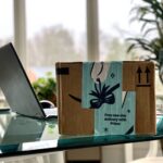 delivered amazon online order box next to laptop o 2026 03 17 00 44 02 utc
