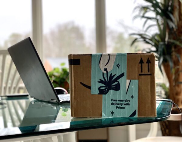 delivered amazon online order box next to laptop o 2026 03 17 00 44 02 utc