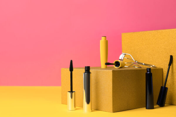different mascaras and eyelash curler on yellow ba 2026 03 27 00 52 43 utc