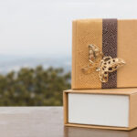 elegant gift boxes on a table with butterfly 2026 03 18 04 26 38 utc