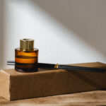 elegant reed diffuser with shadows on wooden surfa 2026 03 19 07 08 30 utc