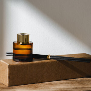 elegant reed diffuser with shadows on wooden surfa 2026 03 19 07 08 30 utc