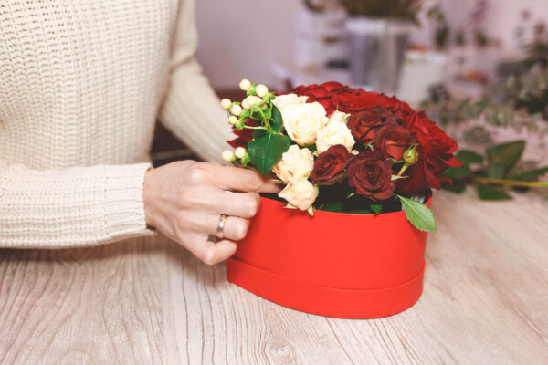 flower shop florist woman making box with red rose 2026 01 05 06 20 55 utc