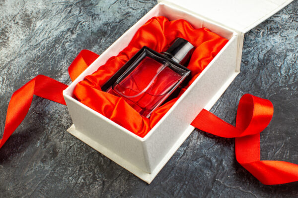 front view of woman perfume on a gift box on red r 2026 01 07 23 39 13 utc