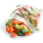 frozen vegetables in plastic bag isolated on white 2026 03 26 23 59 33 utc