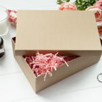 gift box with candle and flowers on table 2026 03 25 00 12 42 utc