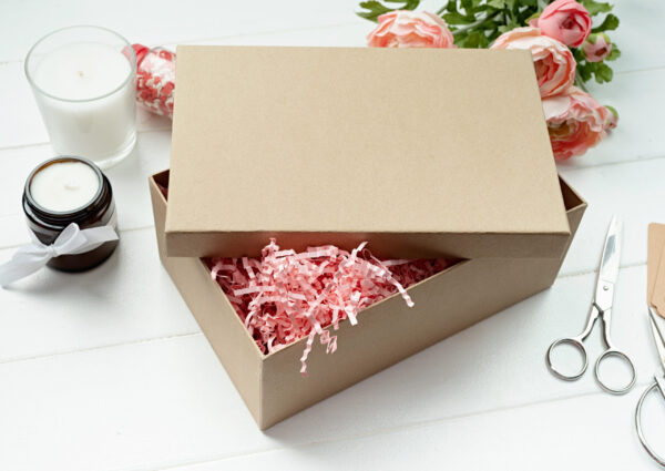 gift box with candle and flowers on table 2026 03 25 00 12 42 utc