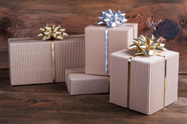 gift boxes with ribbons and bows on wooden backgro 2026 03 15 23 27 07 utc