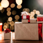 gifts on the background of a christmas tree with a 2026 03 20 00 31 16 utc